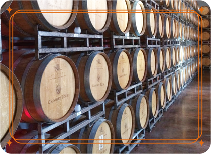 Barrels of wine or spirits are stacked in a warehouse; data loggers & smart sensors